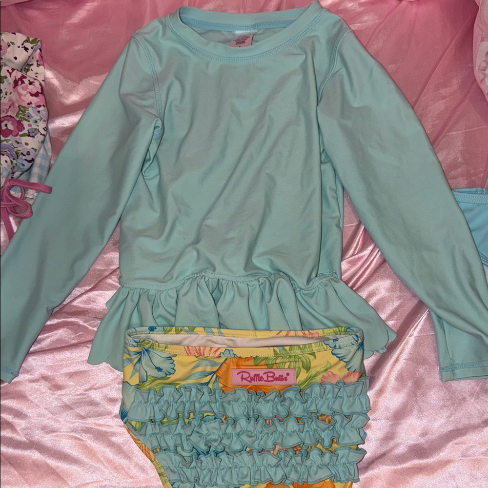 Ruffle Butts Light Blue Swim Top with Pink Tag